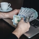 Beginner working on laptop at home in the UK showing how to make £500–£1000 a month online in 2026