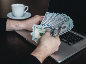 Beginner working on laptop at home in the UK showing how to make £500–£1000 a month online in 2026