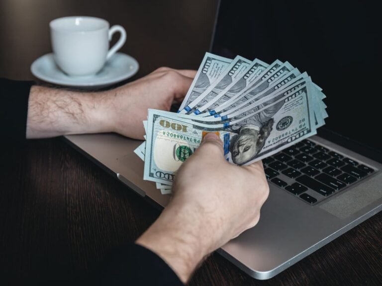 Beginner working on laptop at home in the UK showing how to make £500–£1000 a month online in 2026